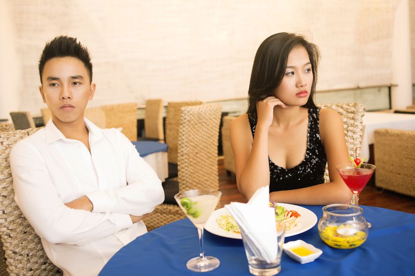 asian couple on a boring date