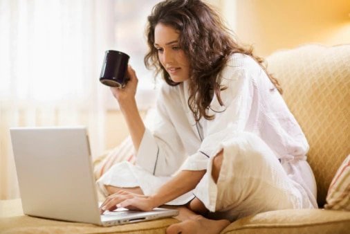 woman with laptop and cup